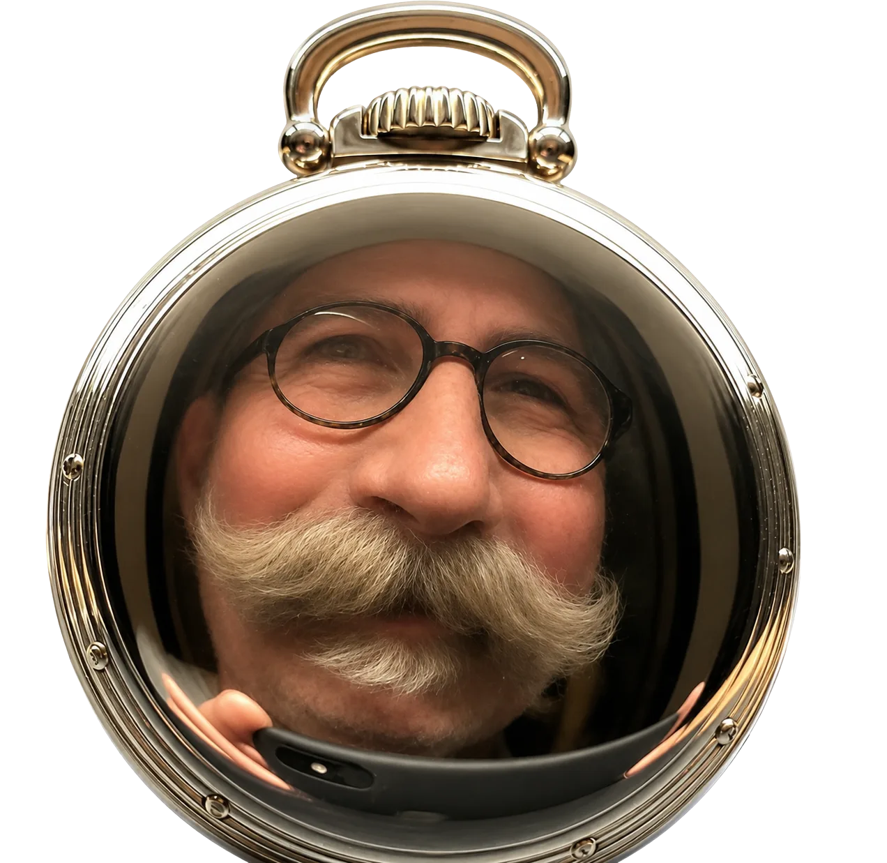 Jeff&rsquo;s face reflected in the polished case back of a pocket watch on his workbench