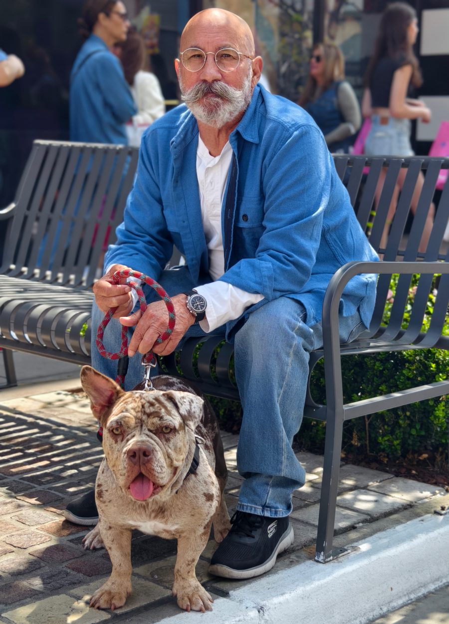 Jeff, The Pocket Watch Guy, seated on a bench with his dog, wearing a chronograph