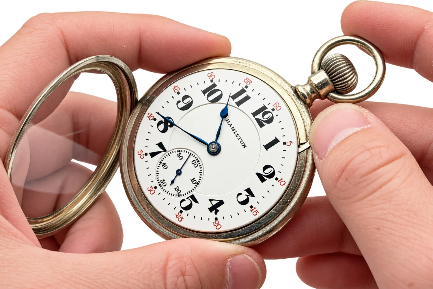 Hands holding an open-face Hamilton pocket watch with the hinged front cover swung back, the dial exposed
