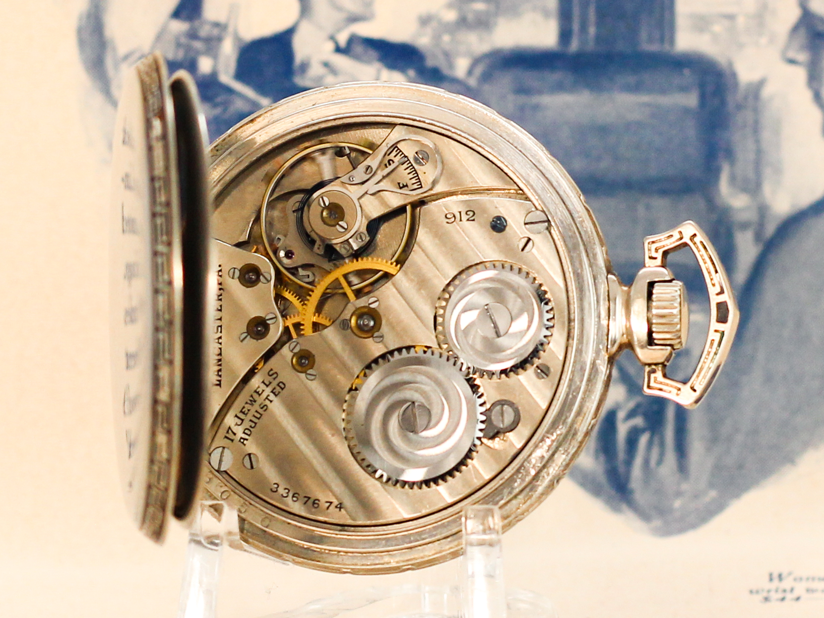 Hamilton dress pocket watch case opened on display stand showing movement