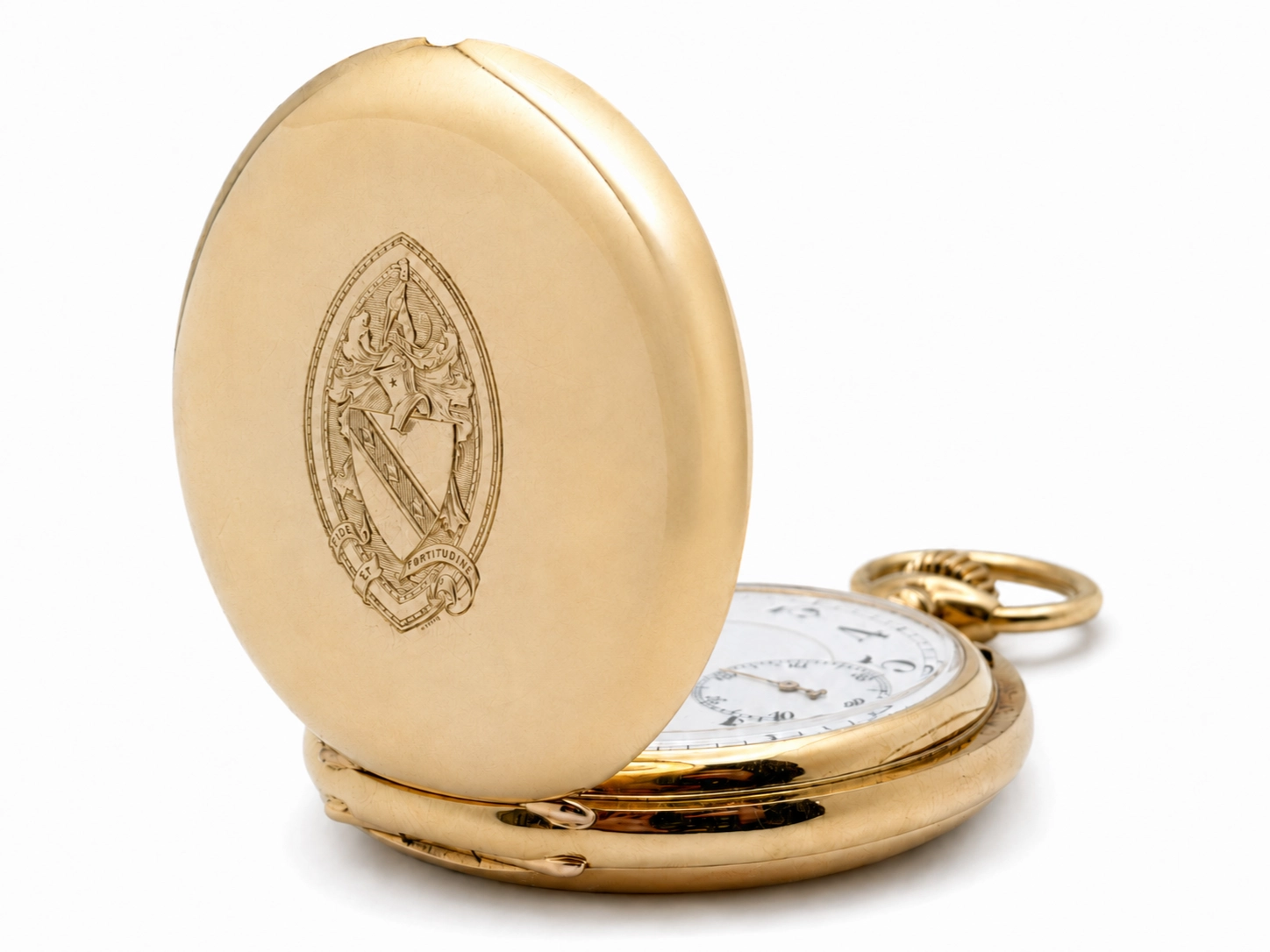 Open gold pocket watch case with heraldic shield engraving and white dial visible inside.