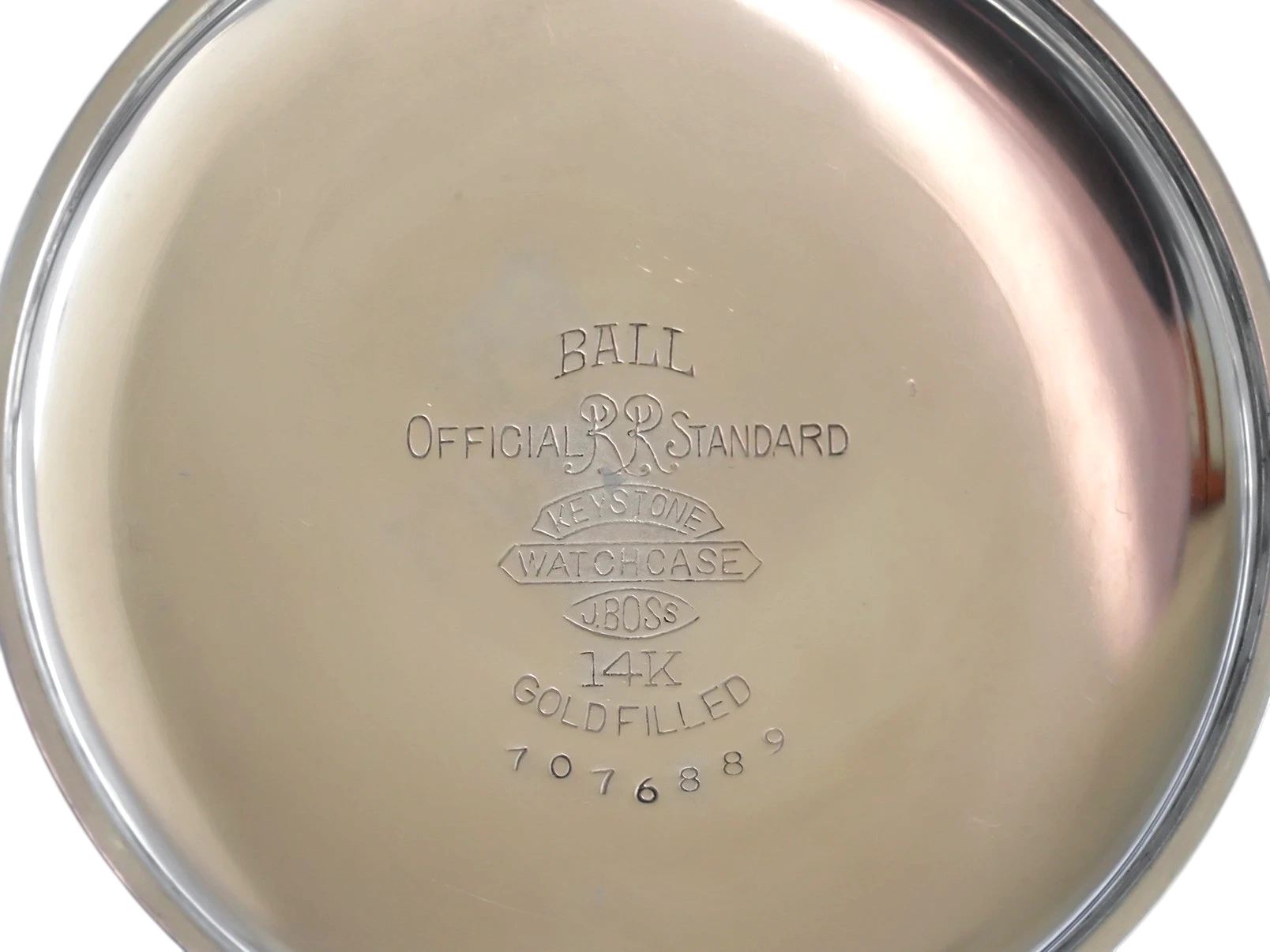 Polished case back engraved with Ball Official Railroad Standard markings and 14K gold-filled hallmark.
