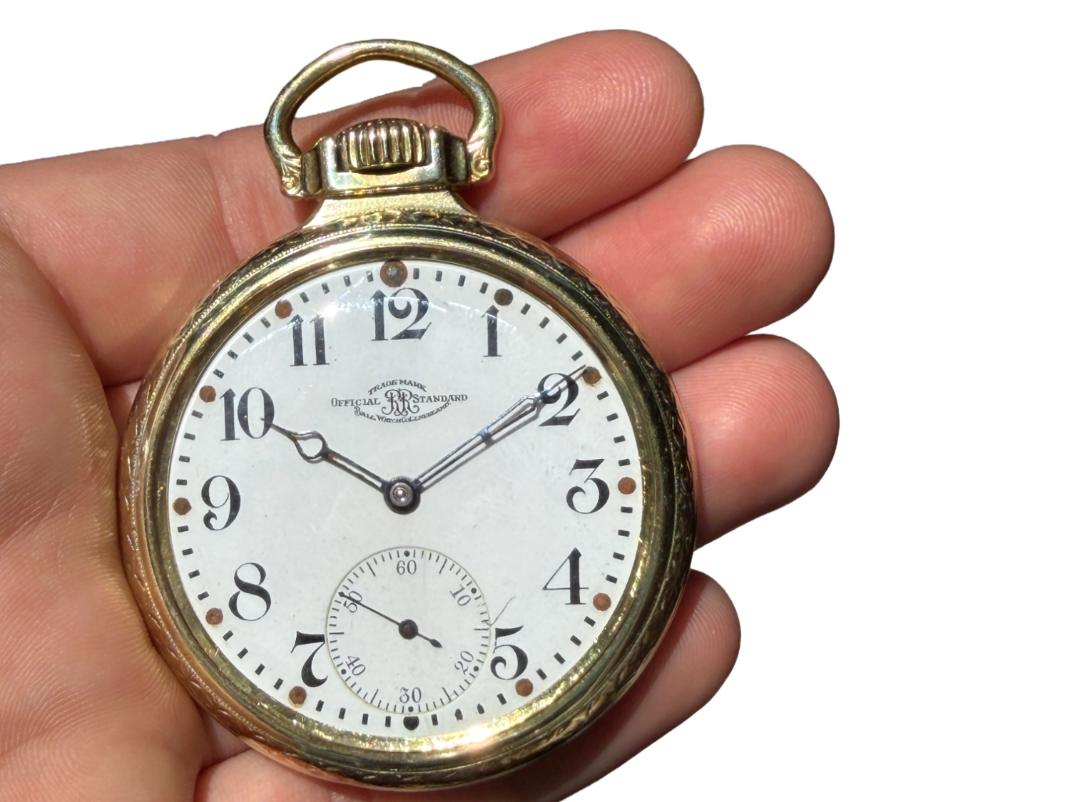 Open-faced pocket watch with white dial, Arabic numerals, subsidiary seconds dial, and decorative hands.