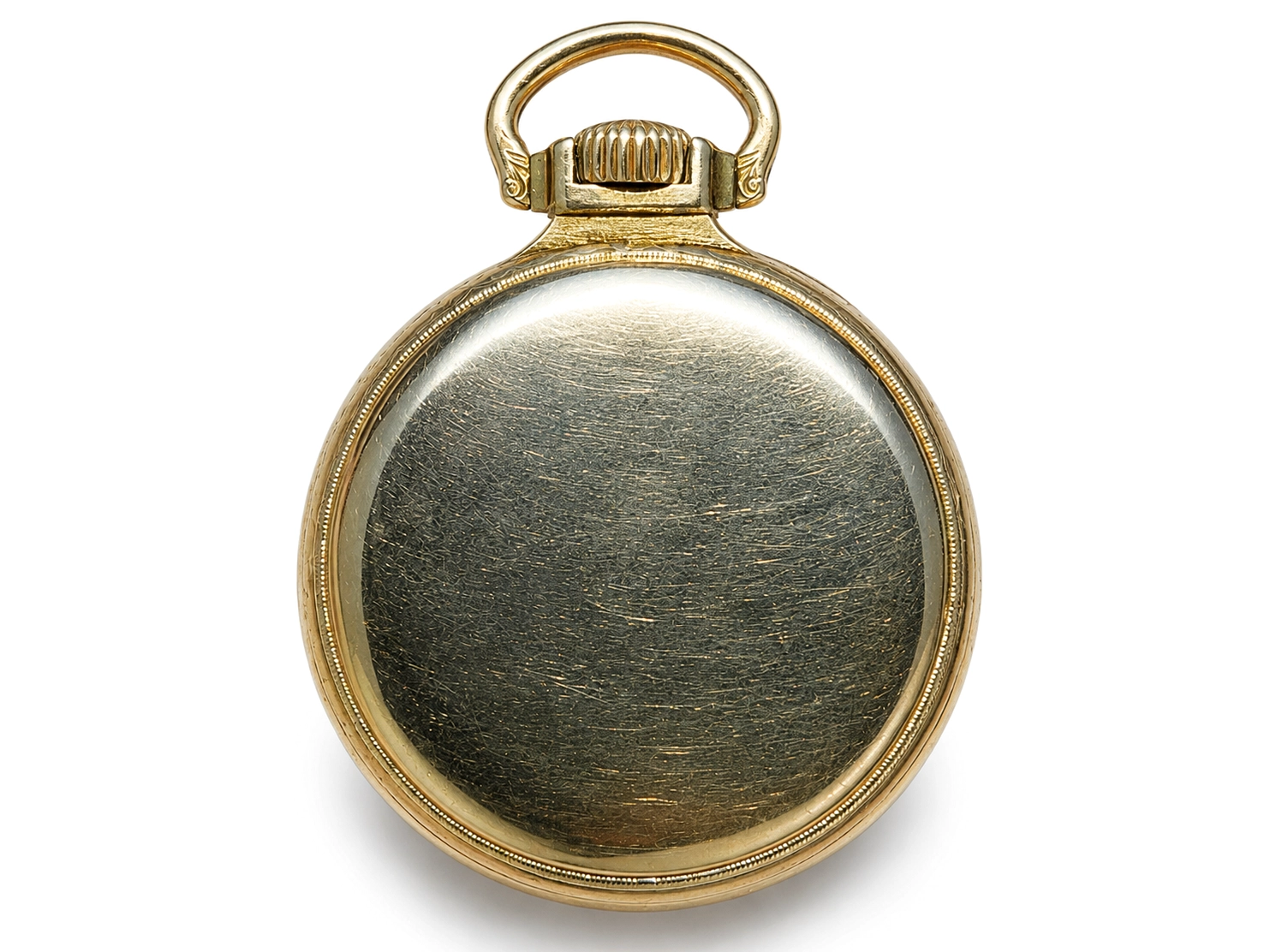 Gold-tone pocket watch case back with polished surface and decorative bezel, viewed from rear.