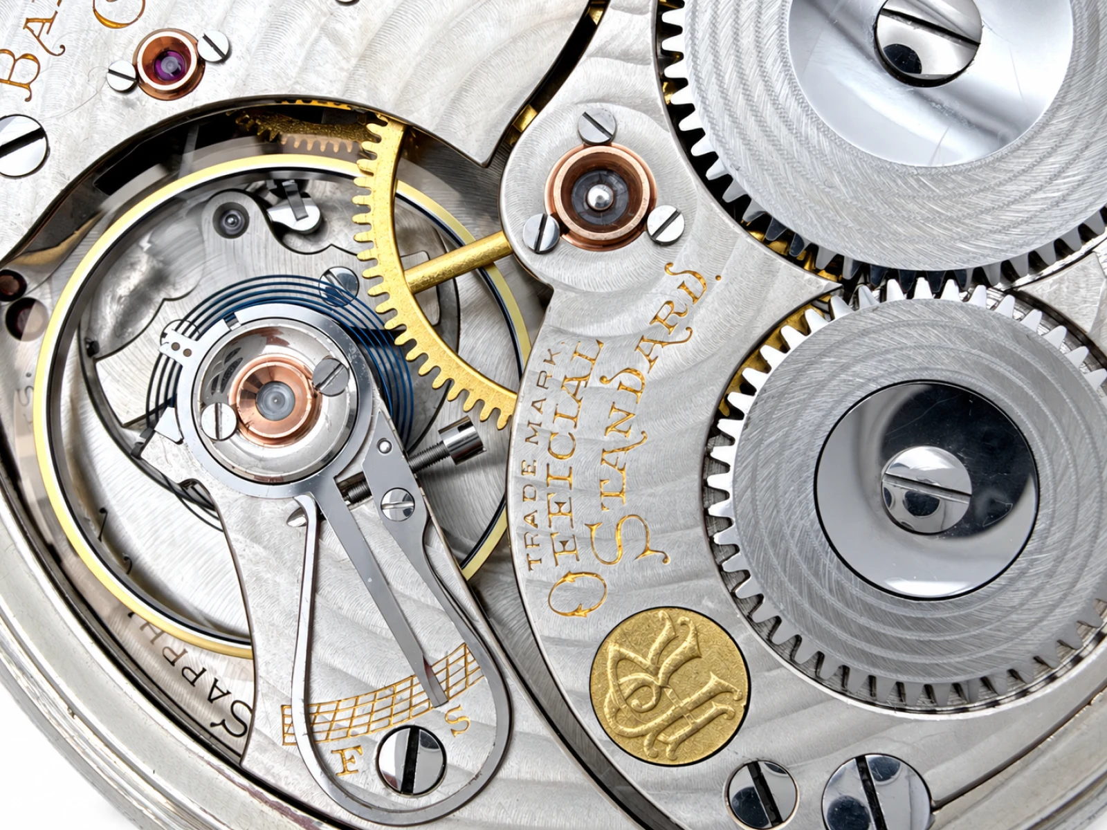 Ball-Waltham Official Standard 21 Jewel (1920) — balance, Breguet hairspring and regulator with the Official Standard trademark and Waltham medallion