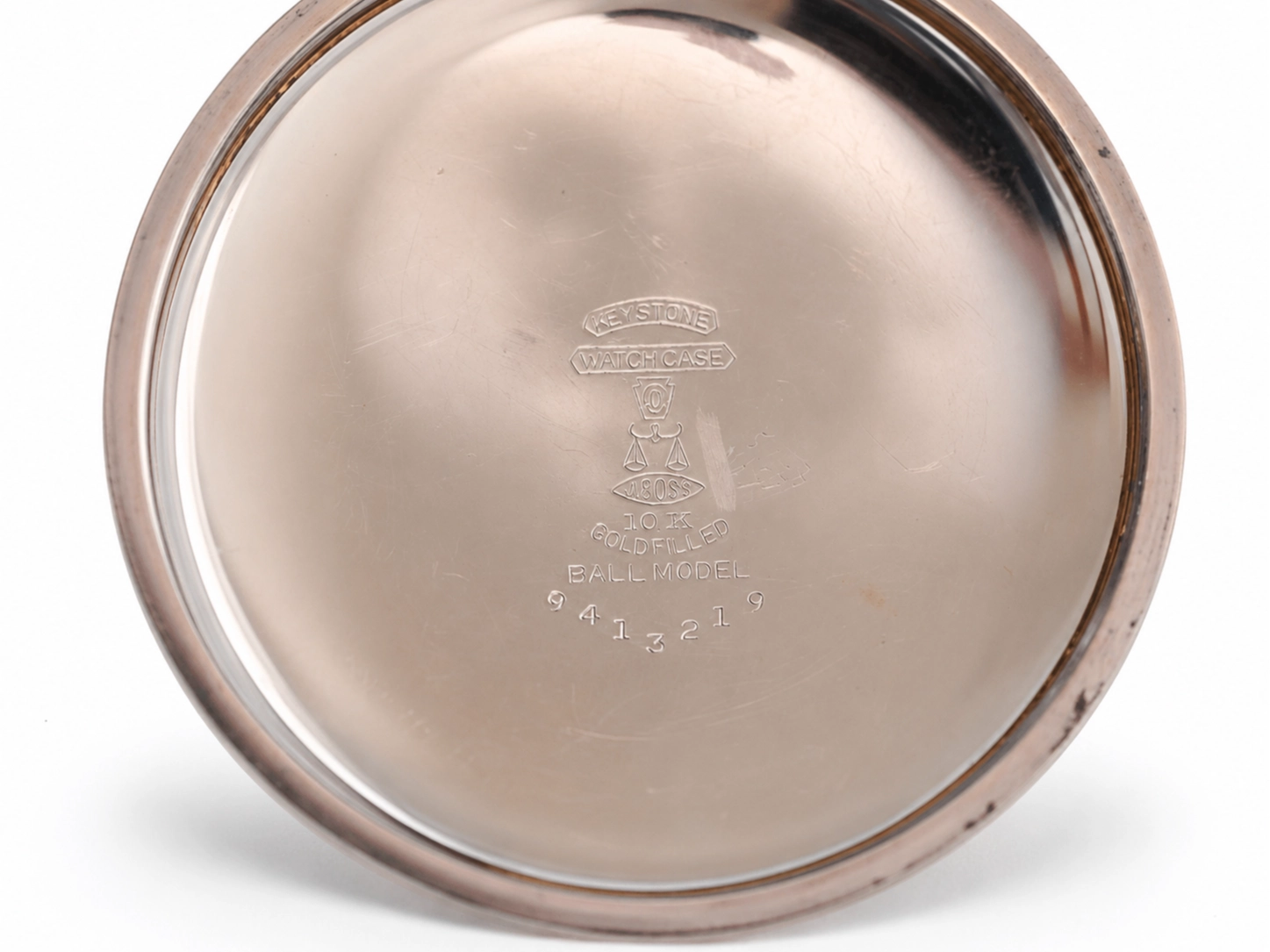 Polished metal case back engraved with "Ball Model" and 10K goldfilled hallmarks