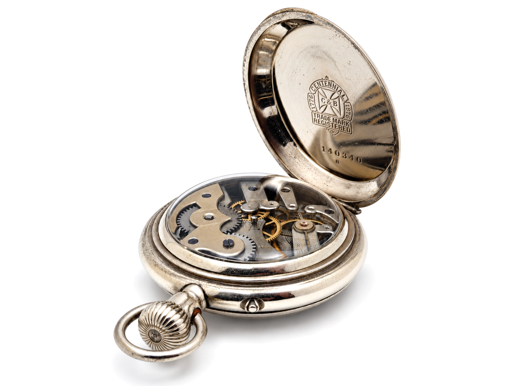 Swiss Cross Beguelin Inner Display Back (1890) — open movement with visible gears, jewels, and decorated wheels in blued and gilt finish