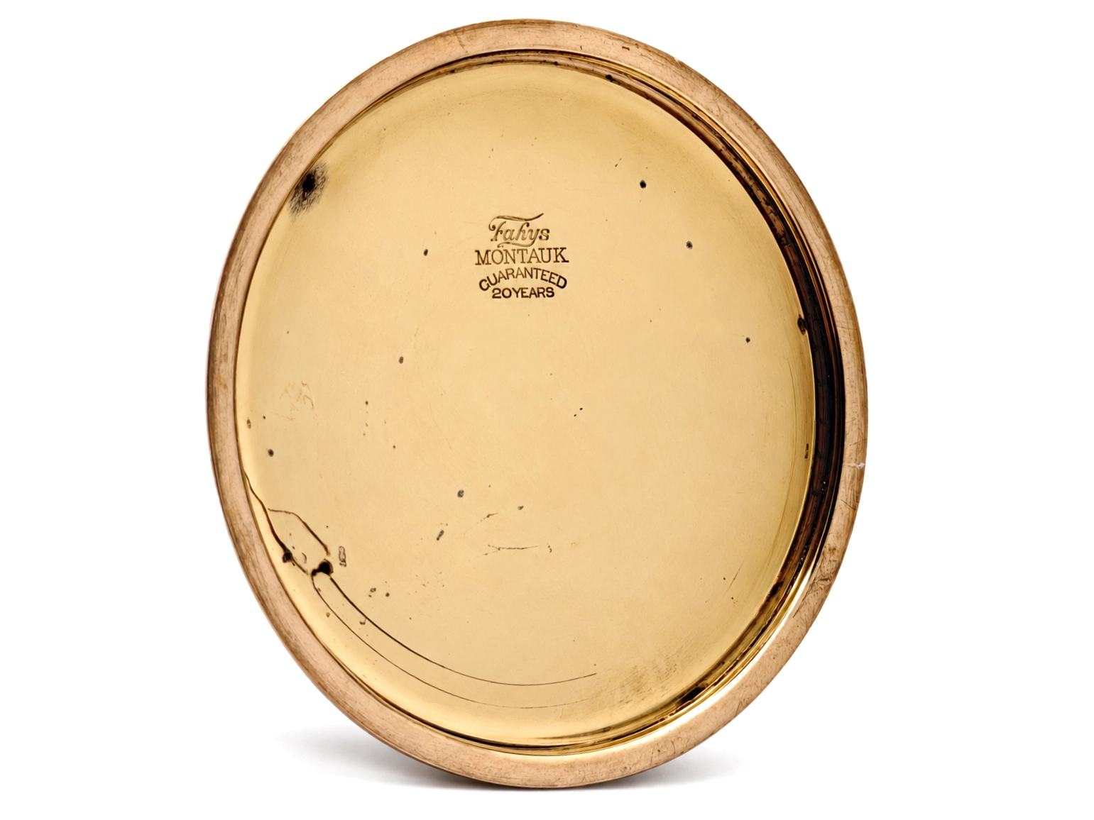 Elgin Father Time Grade 388 — open case back showing Fahys Montauk guarantee marking and 20 years text, aged cream enamel surface
