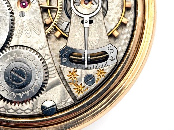 Elgin Father Time Grade 388 — open movement with ornate damaskeened plates, gold-colored floral balance cock, jewels, and winding wheels…