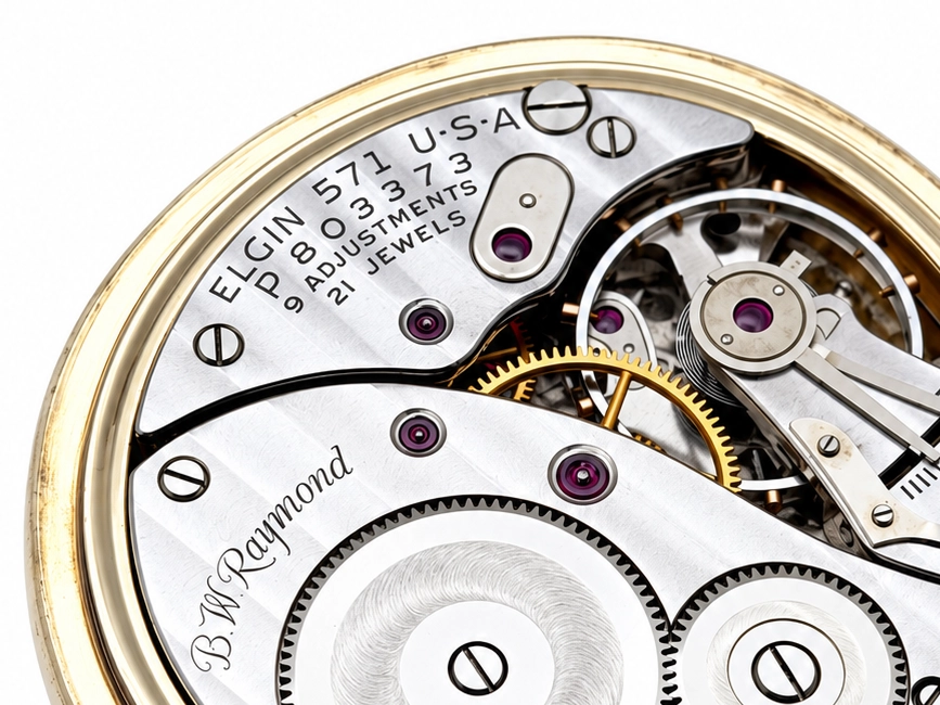 Elgin B.W. Raymond Late-Era Railroad Streamline Case (1953) — open movement displaying jeweled plates, escape wheel, balance cock, and…