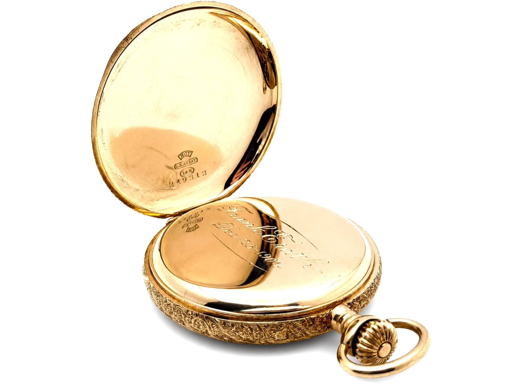 Open gold pocket watch case showing ornate engraved back and visible movement, with hallmarks on interior cover.