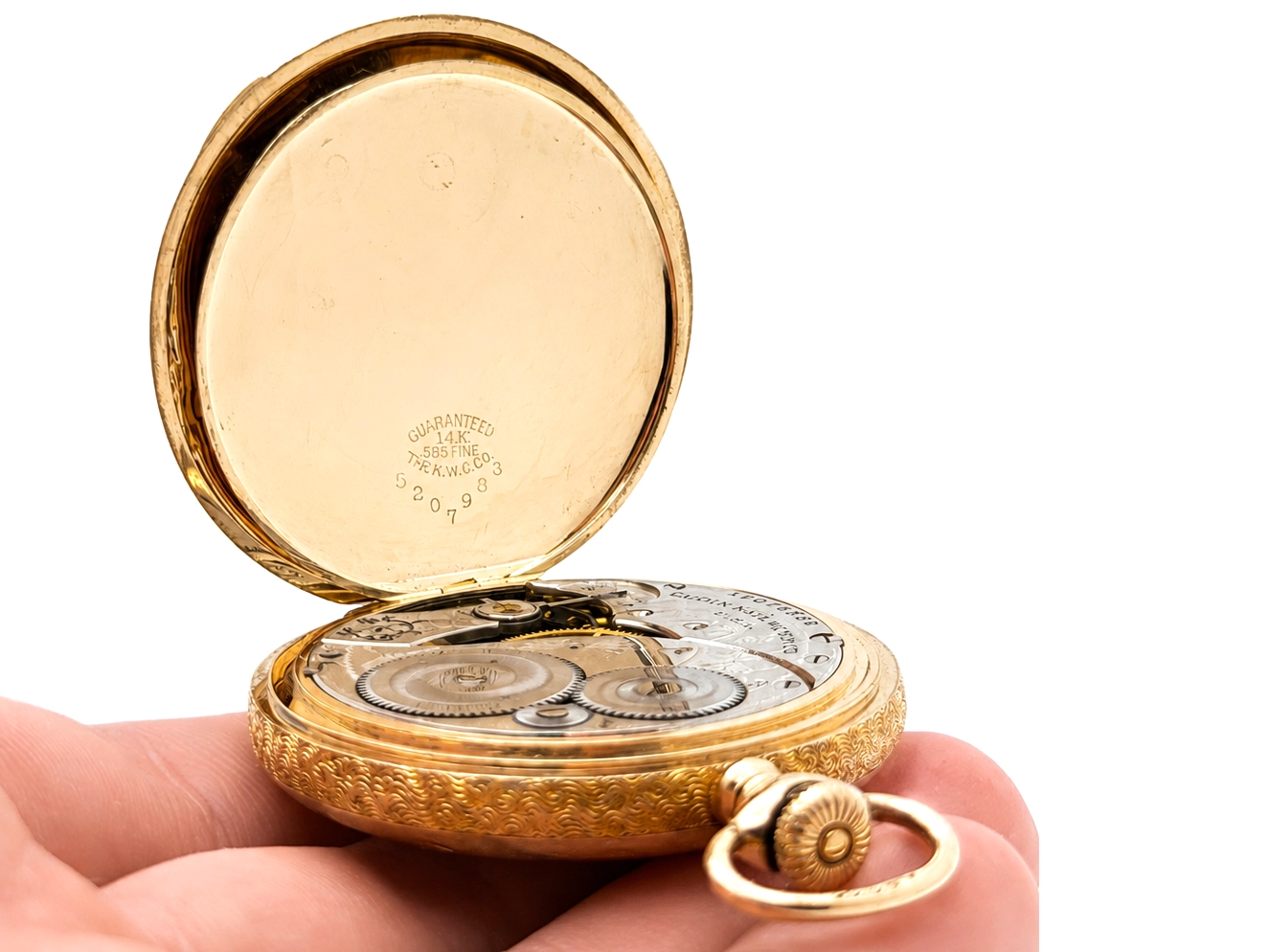 Open gold pocket watch with exposed movement showing gears and balance wheel on cream dial.