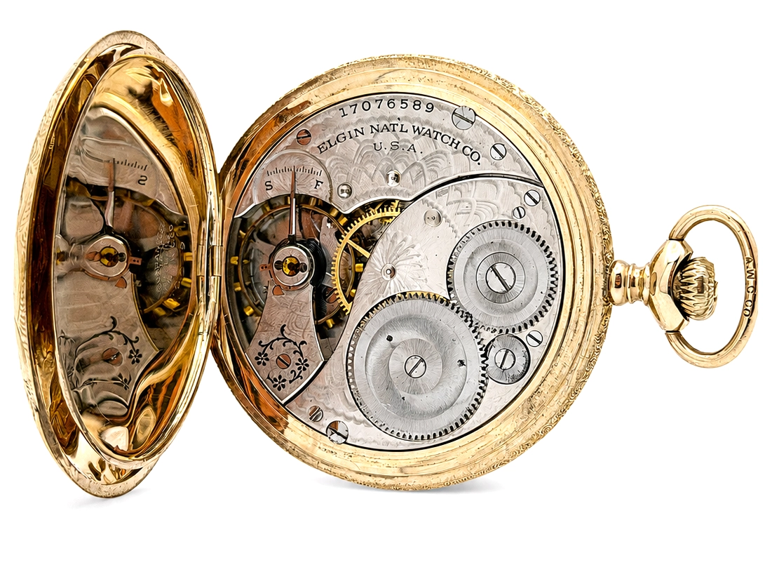 Open-face pocket watch with exposed movement showing balance wheel, gears, and jewels in gold case.