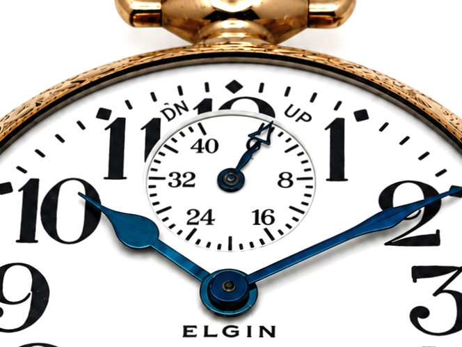 Elgin Father Time 374 with Up/Down Wind Indicator (1917) — white enamel dial with Arabic numerals, subsidiary dial at top showing up/down…
