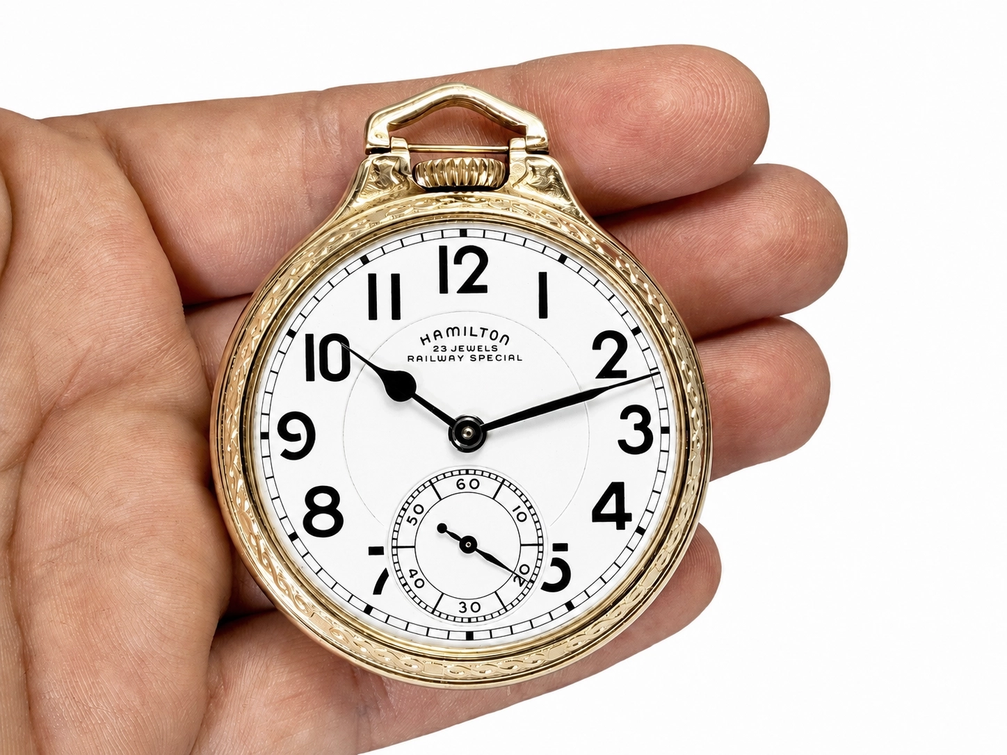 Open-faced pocket watch with white dial, Arabic numerals, and subsidiary seconds dial.