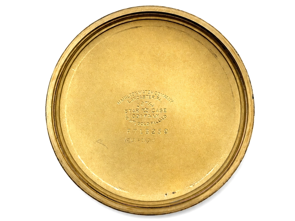 Gold-filled pocket watch case back with engraved text and serial number C171292.