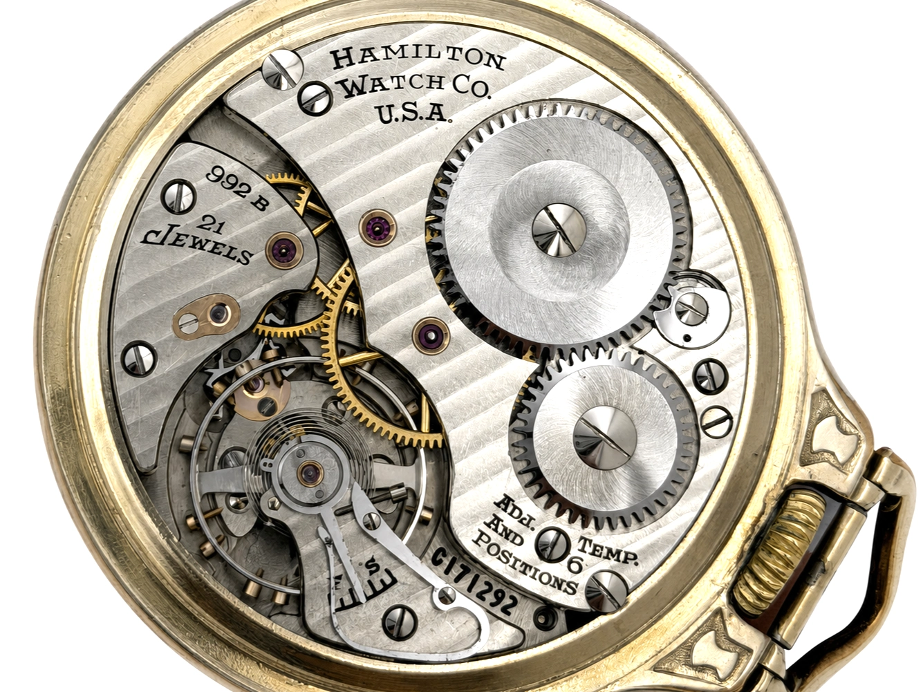 Hamilton Watch Co. movement with 992B caliber, 24 jewels, two gold balance wheels, and gear train visible through open case back.