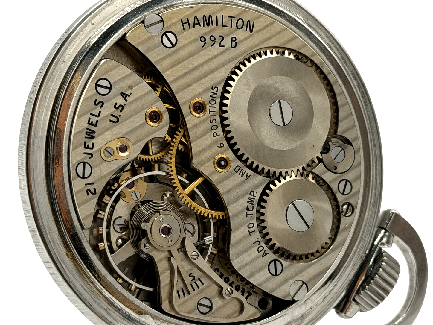 Open Hamilton 992B pocket watch movement with visible jewels, gears, and balance wheel assembly.