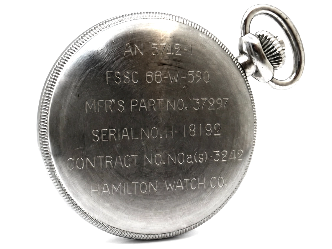 Polished steel case back with military engravings including serial number, part numbers, and Hamilton Watch Co maker mark.