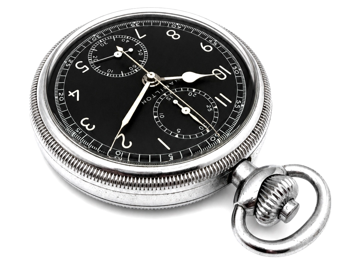 Antique pocket watch with black dial, two subdials, Arabic numerals, and silver hands with integral chain.