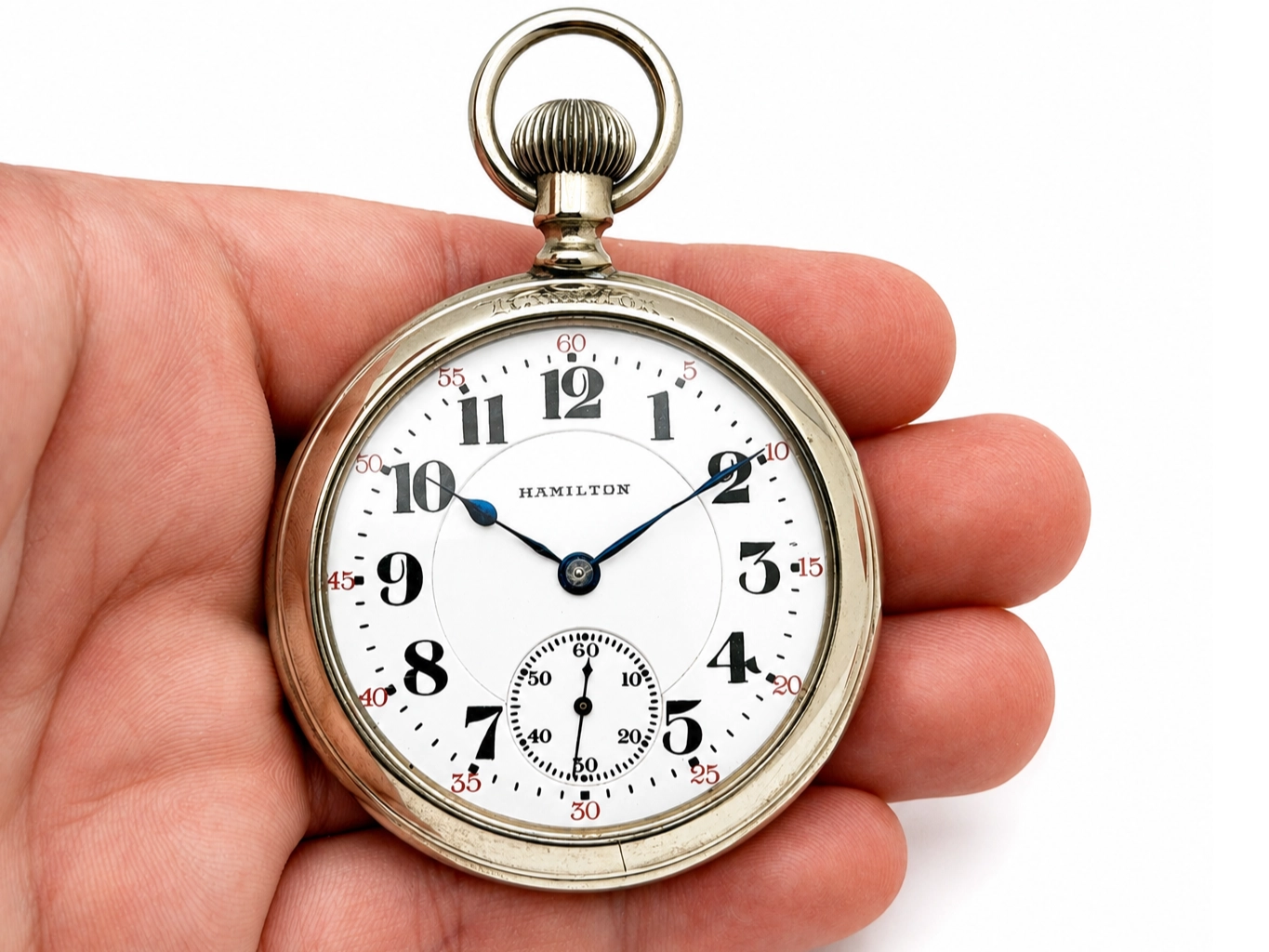 Hamilton 950 Salesman Display Case (1922) — front dial with Arabic numerals, blue and black hands, subsidiary seconds dial at bottom