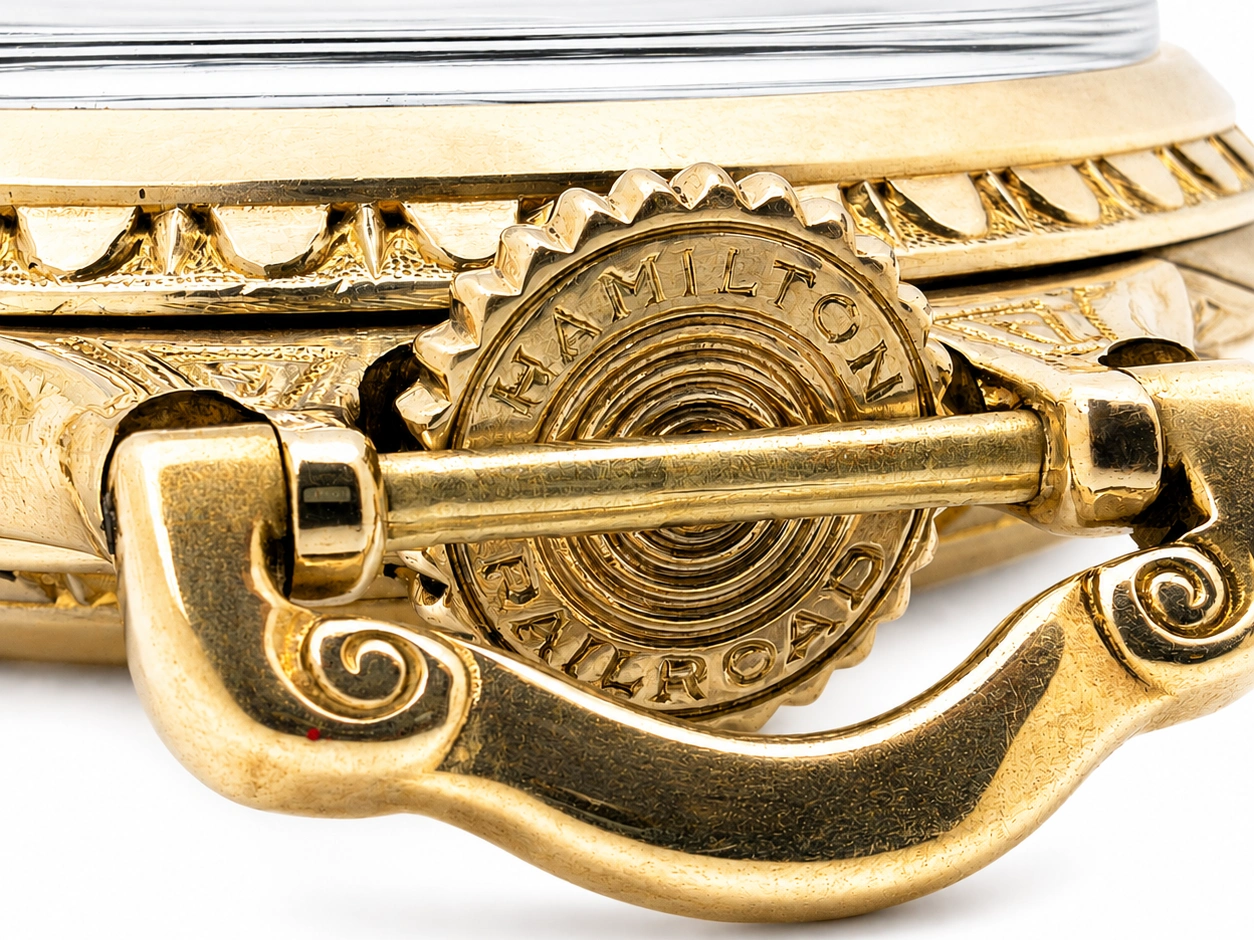 Hamilton Grade 992 (1927) — open case back showing engraved gear wheel and ornate gold-filled case with decorative scrollwork