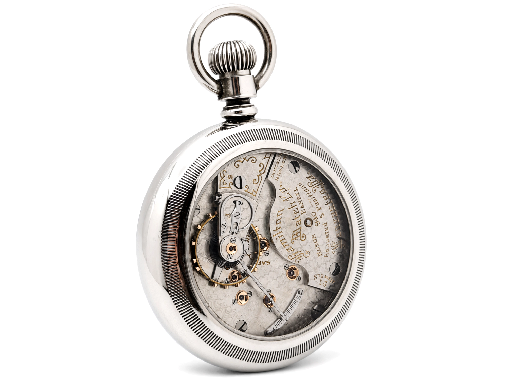Open pocket watch showing exposed jeweled movement with engraved balance cock and polished metal plates.