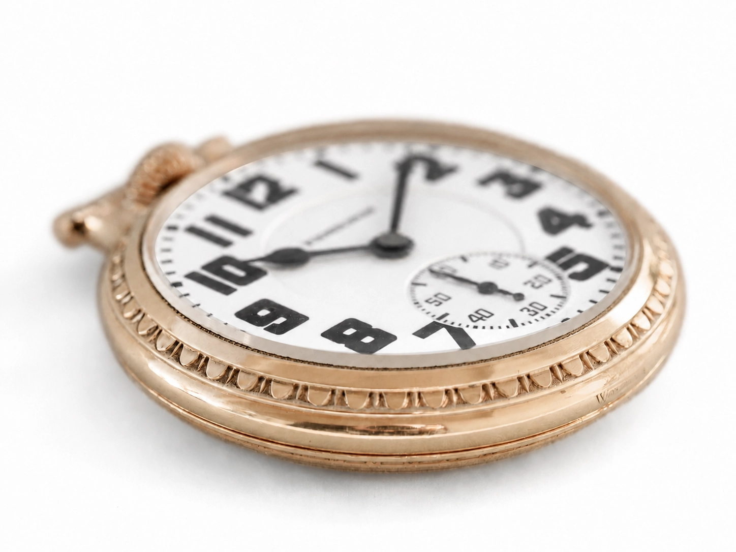 Rose gold pocket watch with white dial, Arabic numerals, and subsidiary seconds dial at 6 o'clock.