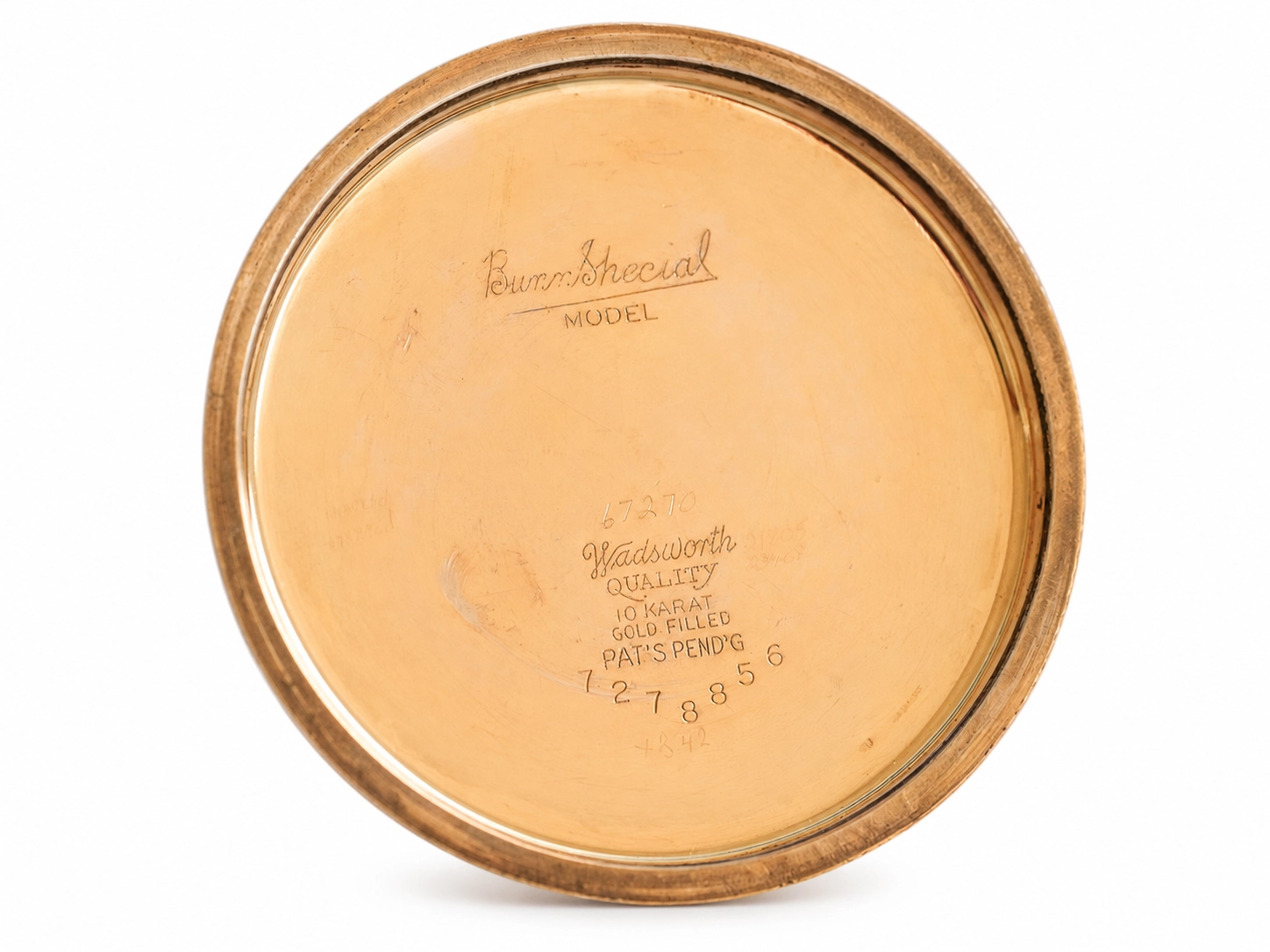 Gold-filled case back with engraved text showing Wadsworth quality and 10 karat marking.