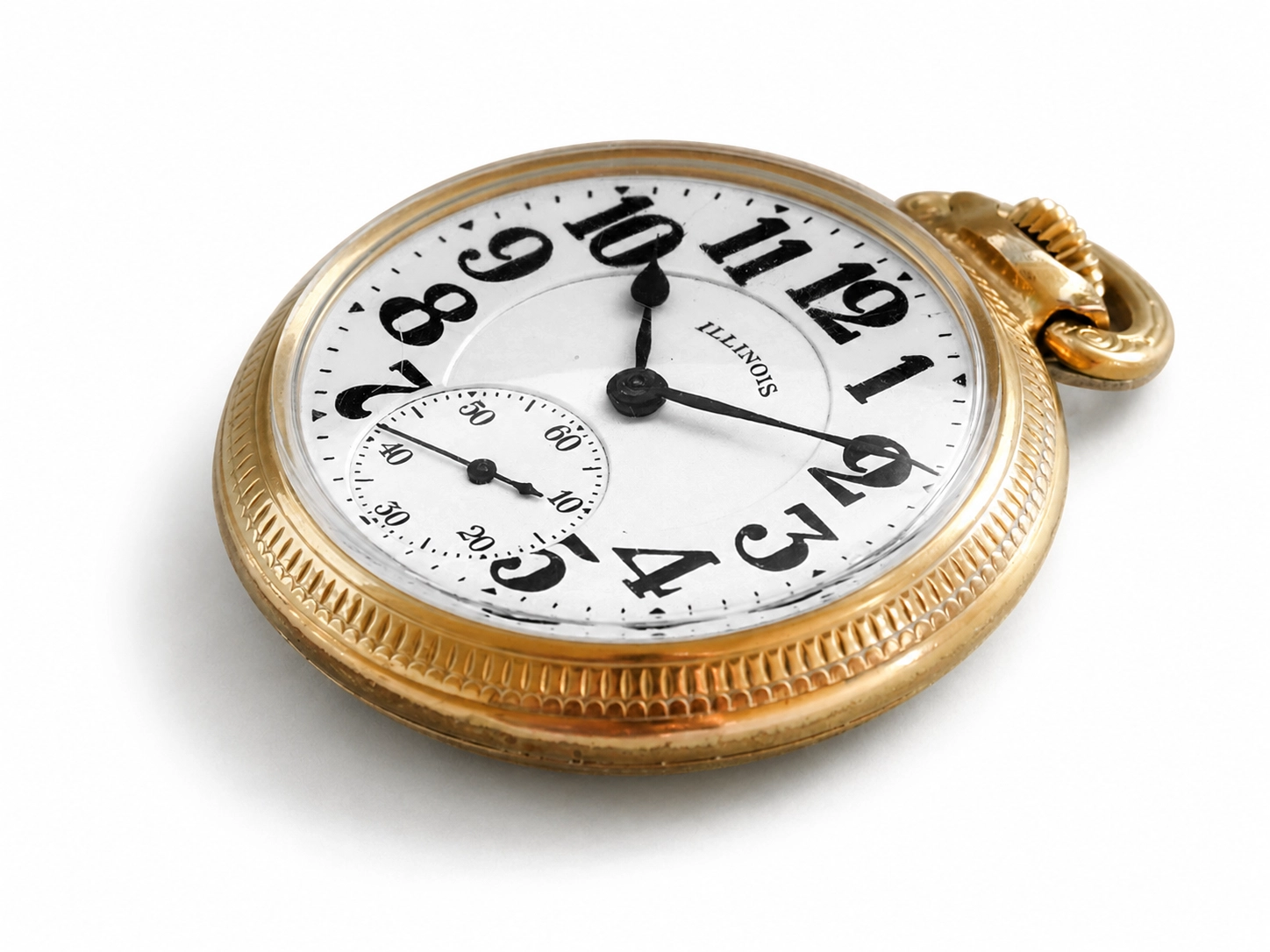 Gold pocket watch with white dial, black Arabic numerals, and subsidiary seconds subdial at 6 o'clock.