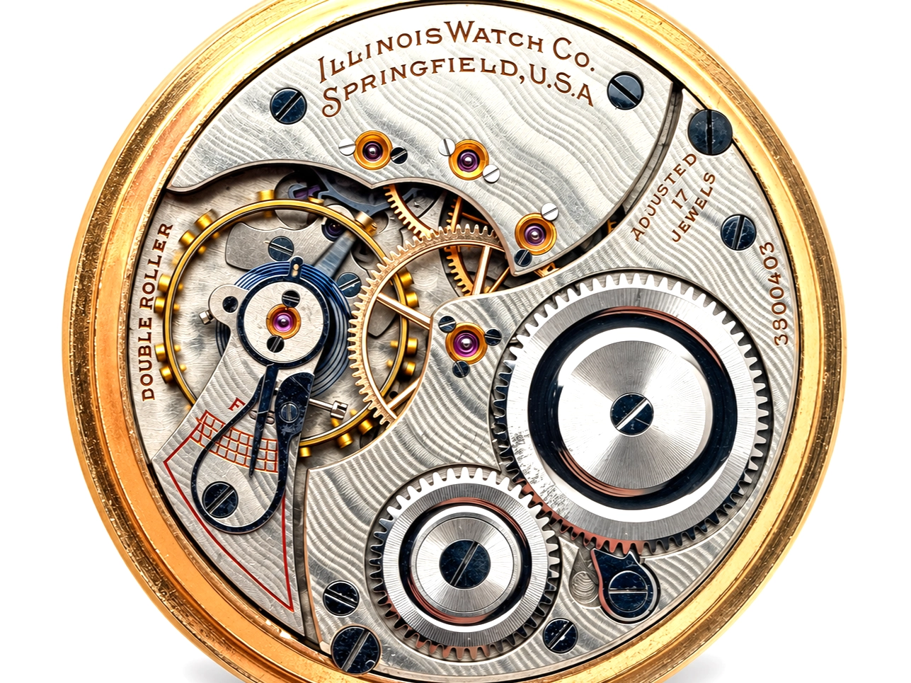 Illinois Dress 605 (1921) — open movement displaying decorated balance wheel, escapement, and jeweled gear train with striped plates
