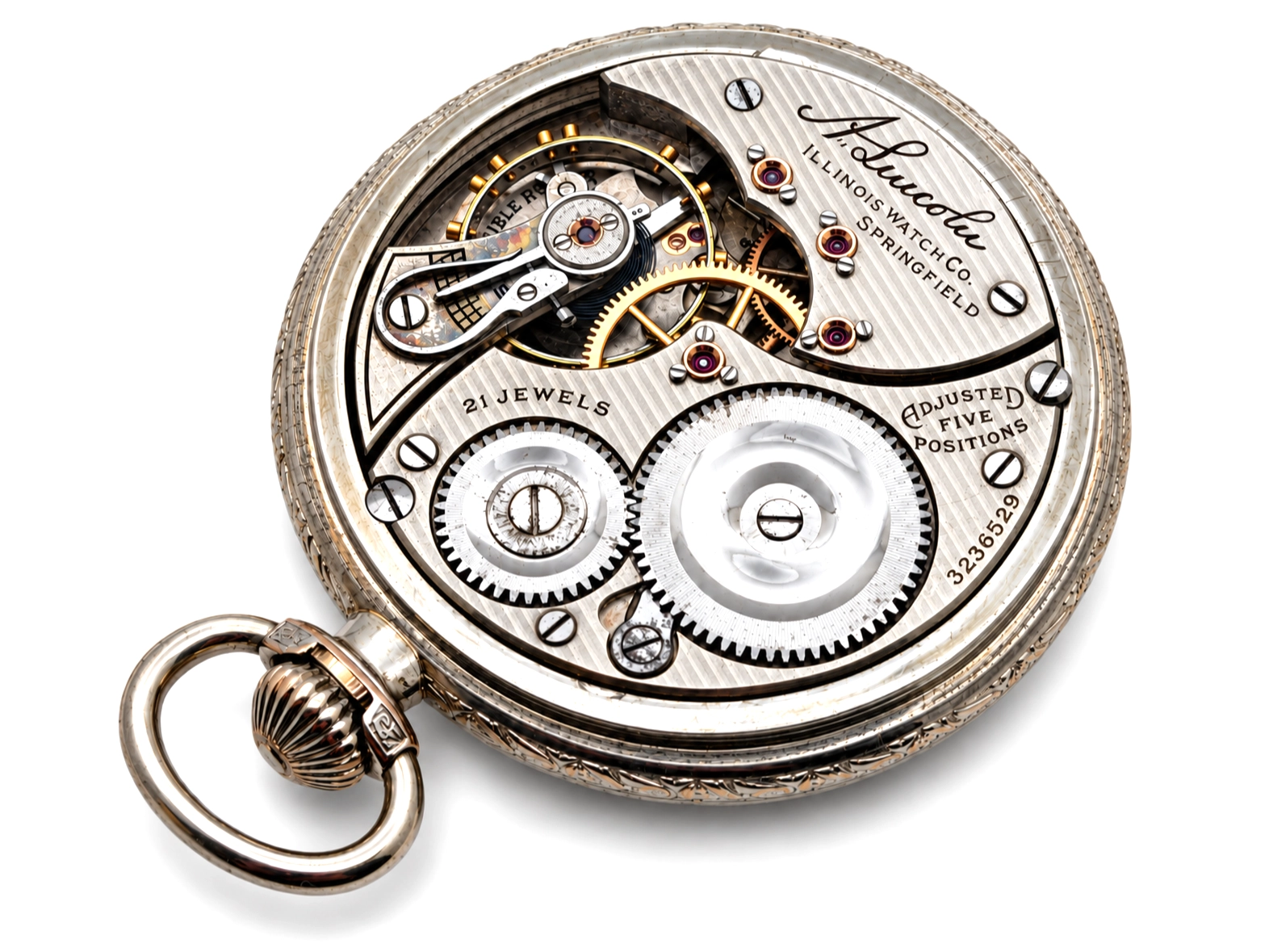 Illinois A. Lincoln White GF Wadsworth Case (1917) — open movement showing decorated balance wheel, jeweled bearings, gears, and lever…