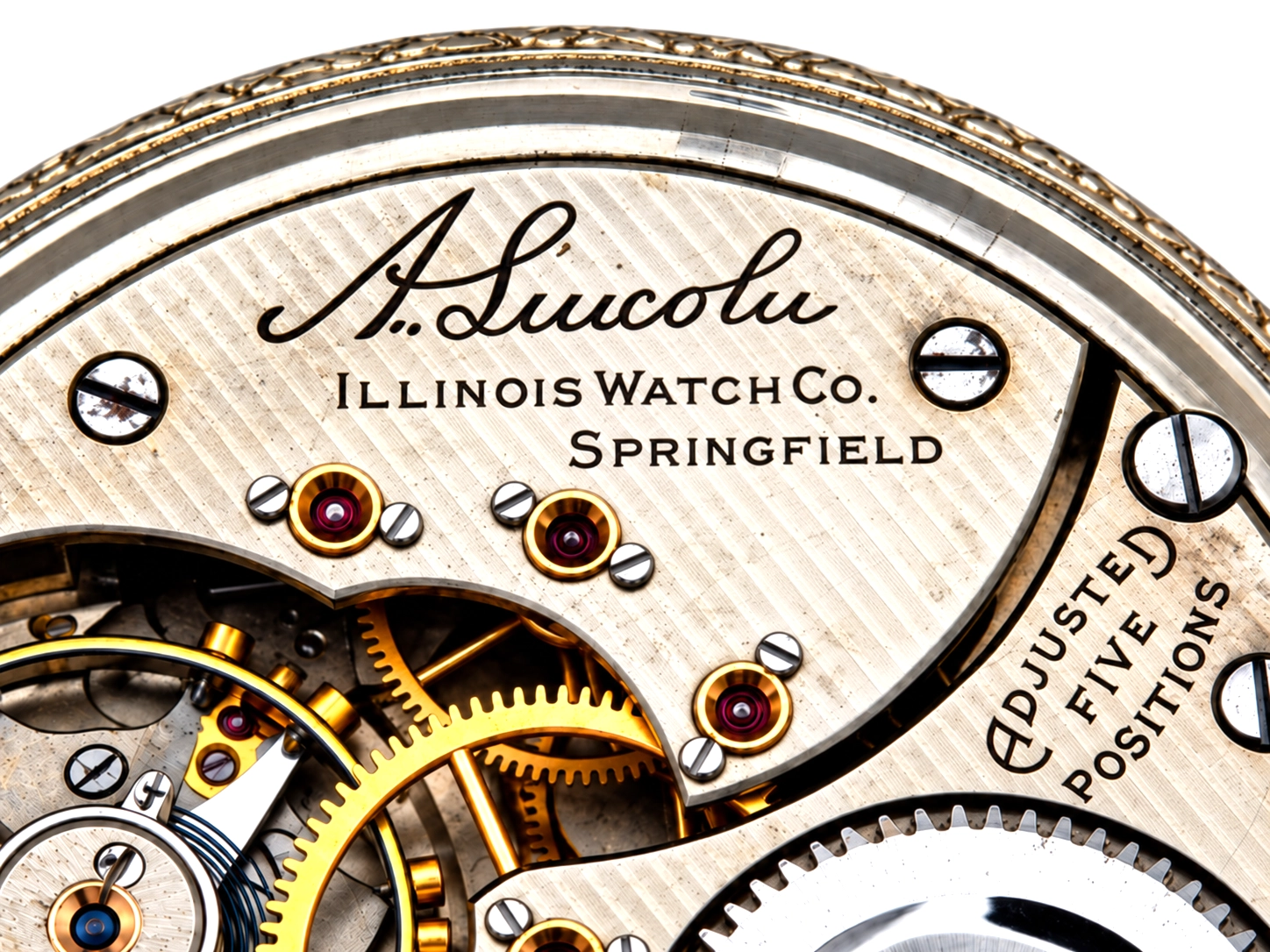 Illinois A. Lincoln White GF Wadsworth Case (1917) — open movement revealing jeweled bearings, decorated golden wheels, and subsidiary…
