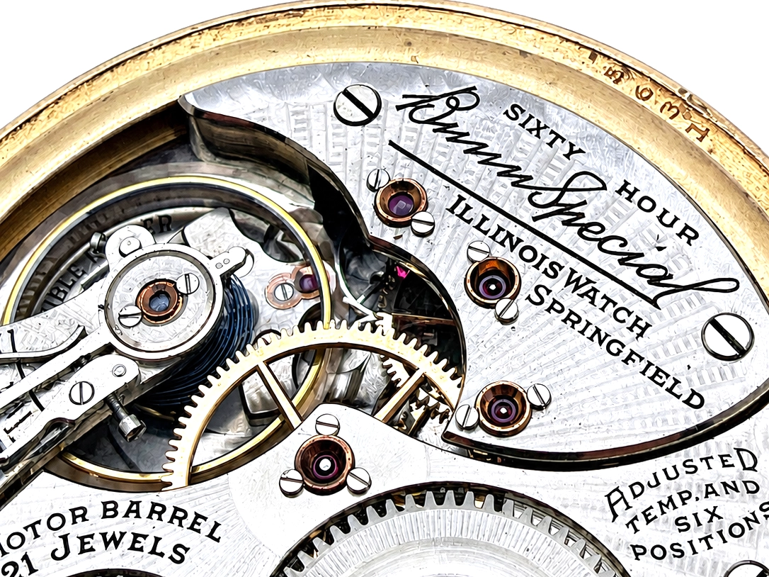 Illinois Bunn Special Type III with Montgomery Dial (1929) — open movement with engraved balance wheel, jeweled bearings, brass gears, and…