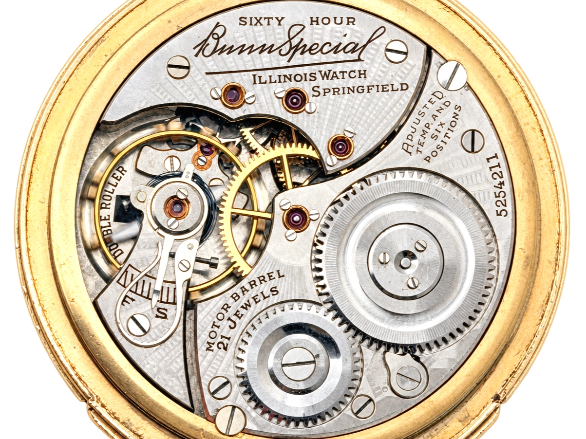 Illinois Bunn Special Type III with Montgomery Dial (1929) — exposed movement with decorated balance wheel, jeweled cap stones, and…