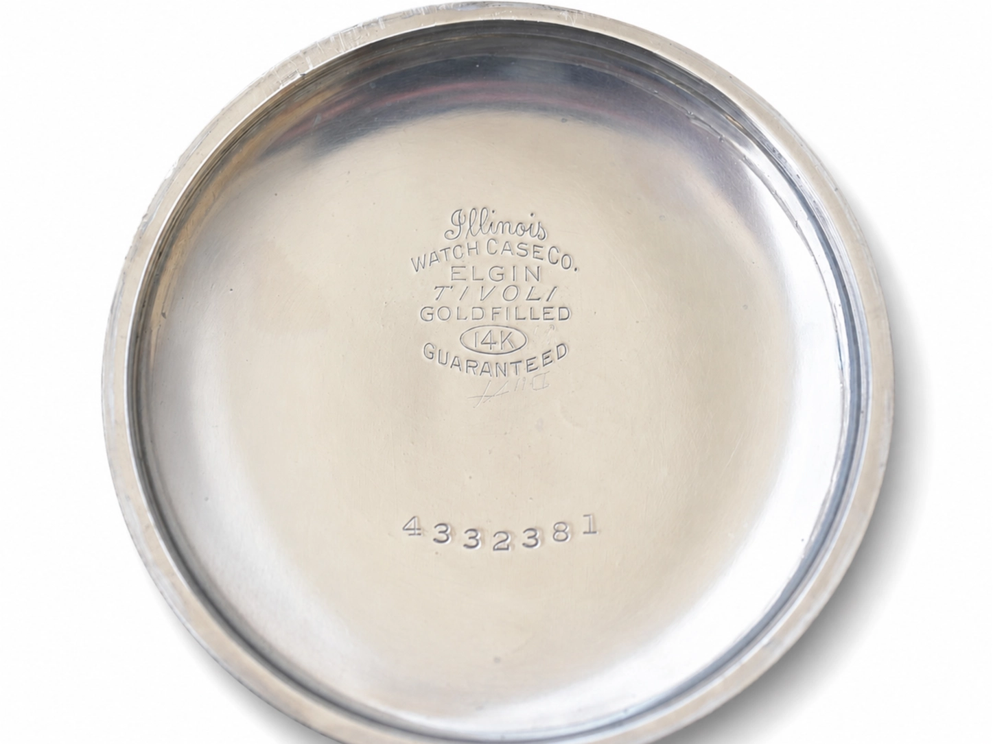 Case back showing Illinois Watch Case Co. Elgin goldfilled 14K guaranteed marking and serial number.