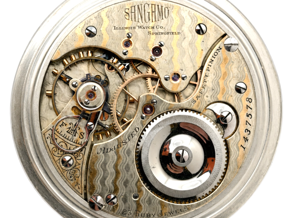 Open pocket watch movement showing jeweled escapement, balance wheel, and damascened plate with serial number 1437578.