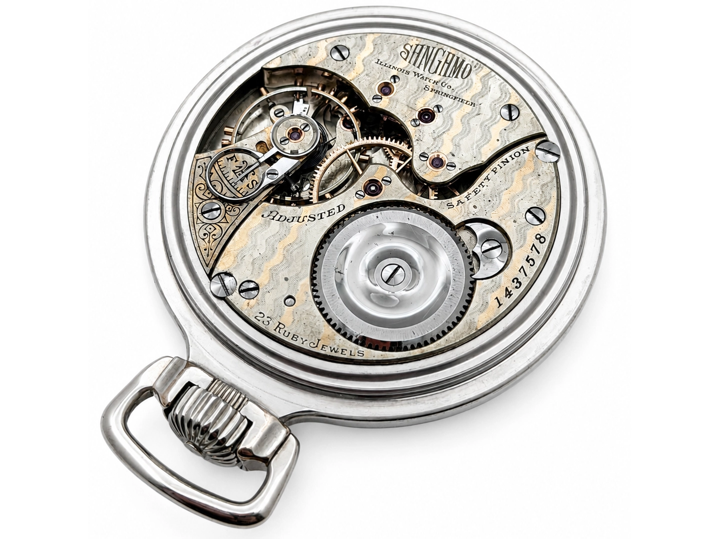 Exposed pocket watch movement showing balance wheel, jeweled plates, and ornate gearing.