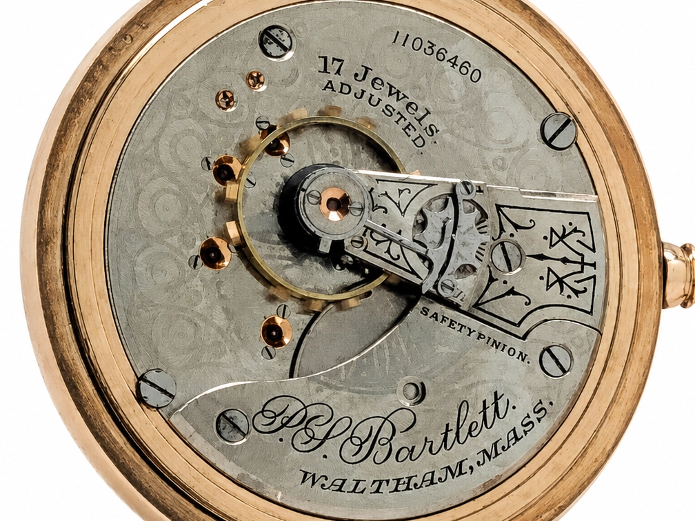 Exposed movement showing 17 jewels, balance wheel, safety pinion, and Waltham Bartlett maker's mark.