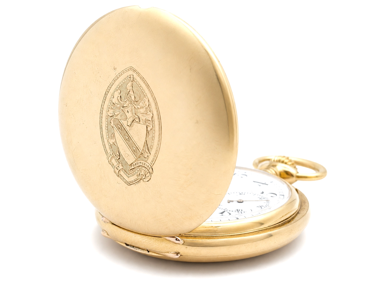 Gold case back with engraved heraldic coat of arms, watch open showing white dial and gold ring.