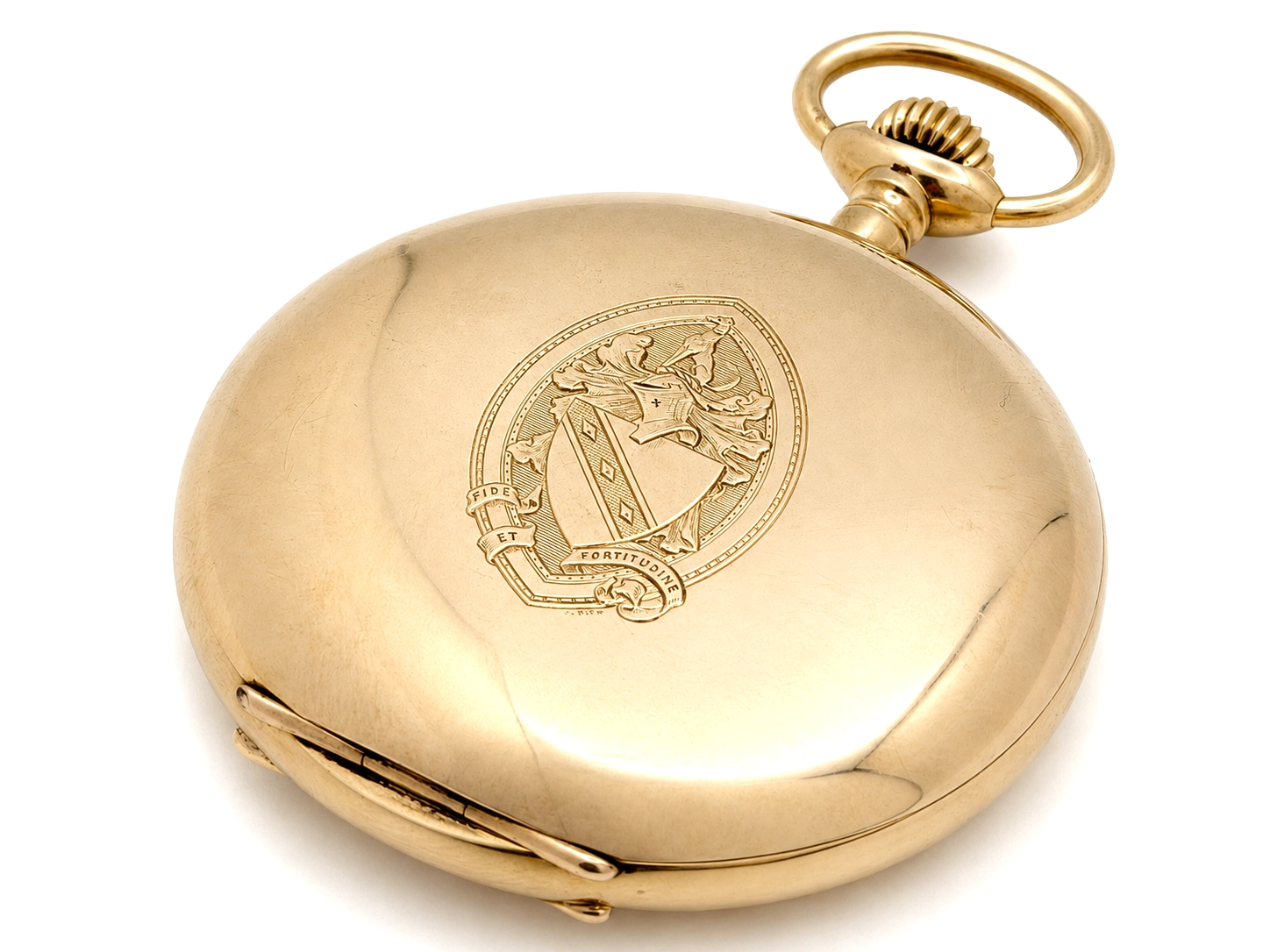Gold pocket watch case with engraved heraldic crest and fixed bail loop.
