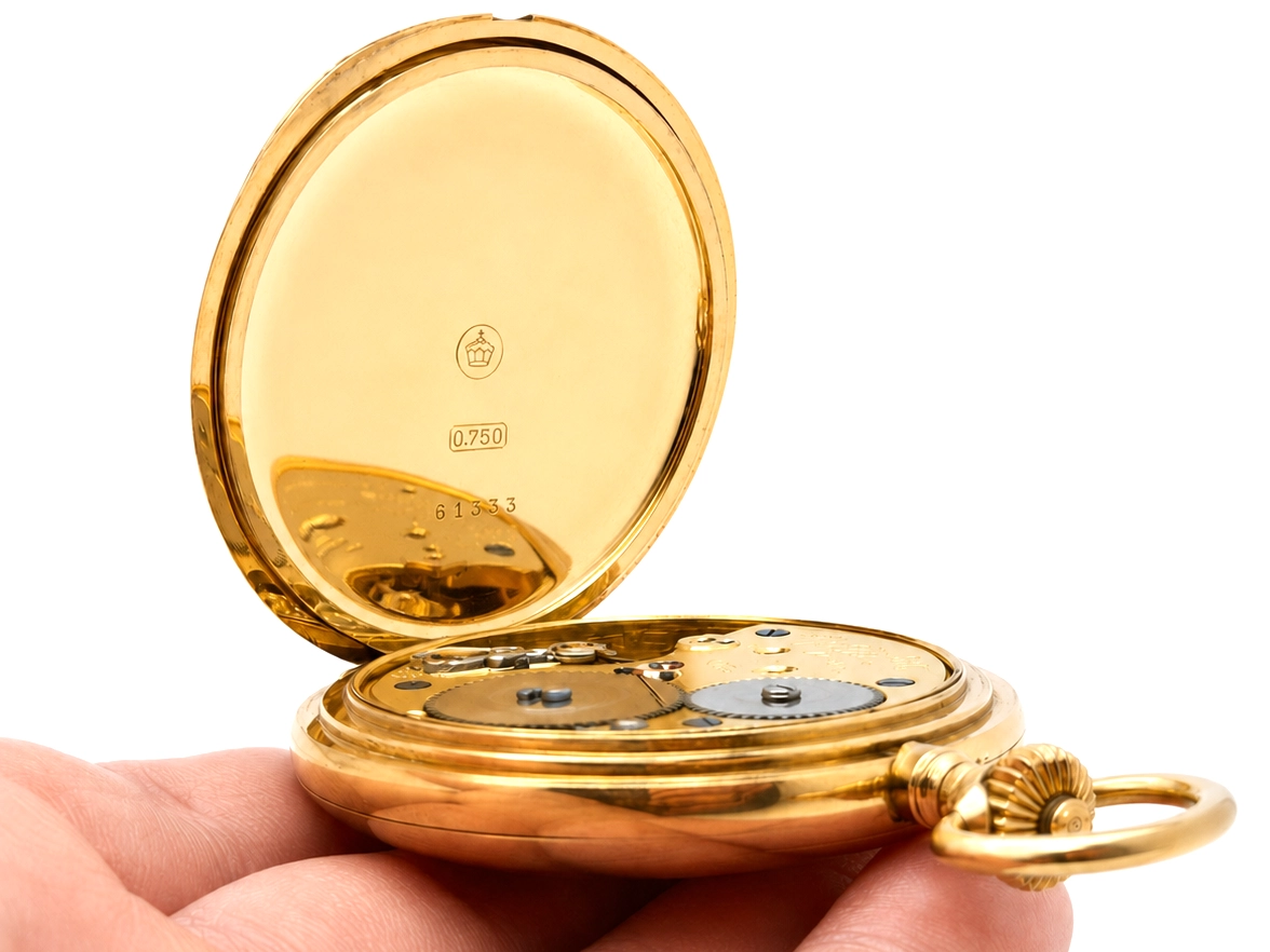 Gold pocket watch case back with 0.750 hallmark, maker's mark, and serial number 61333 visible.