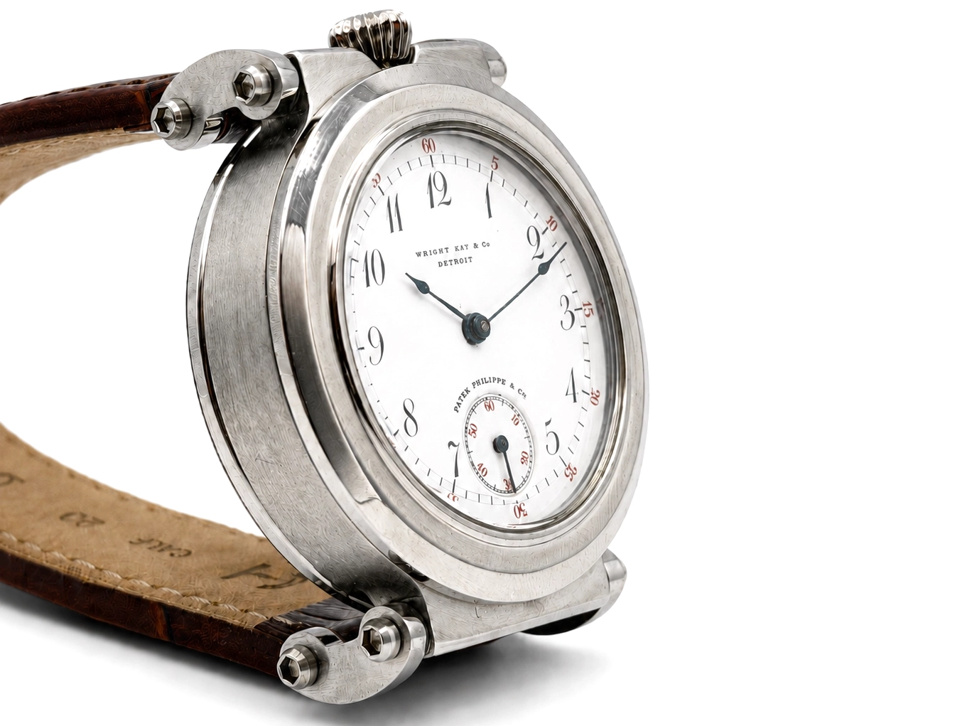 Pocket watch with white dial, Arabic numerals, subsidiary seconds dial, and leather strap attachment lugs.