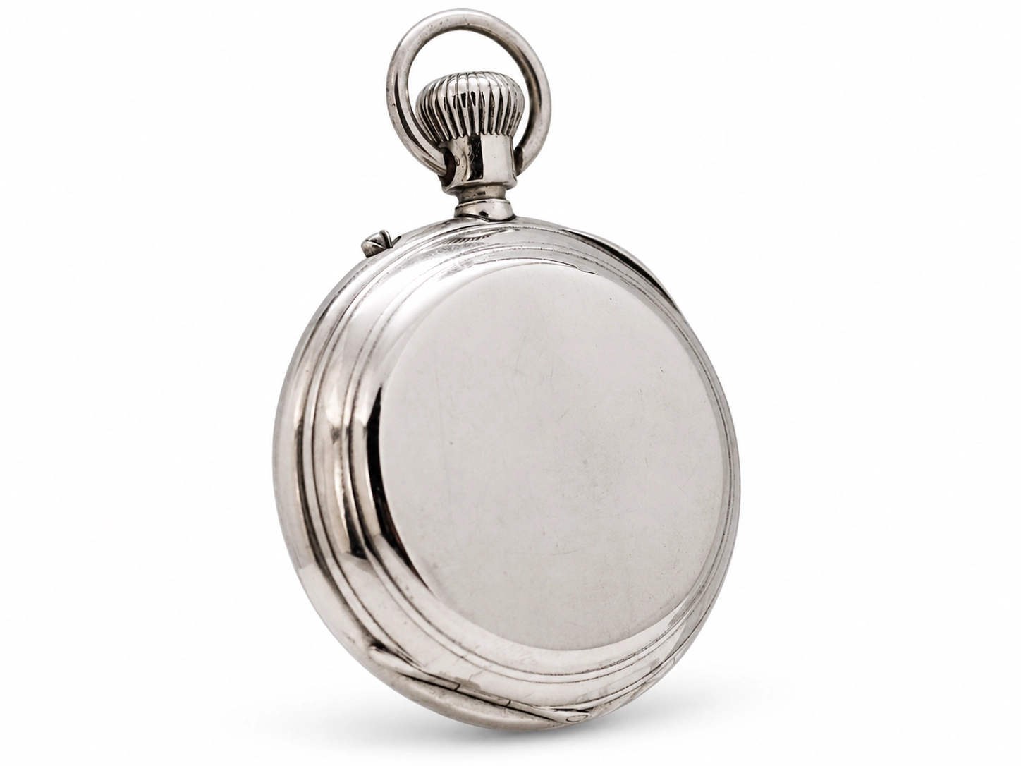 Polished silver pocket watch case with smooth back panel and ribbed crown.