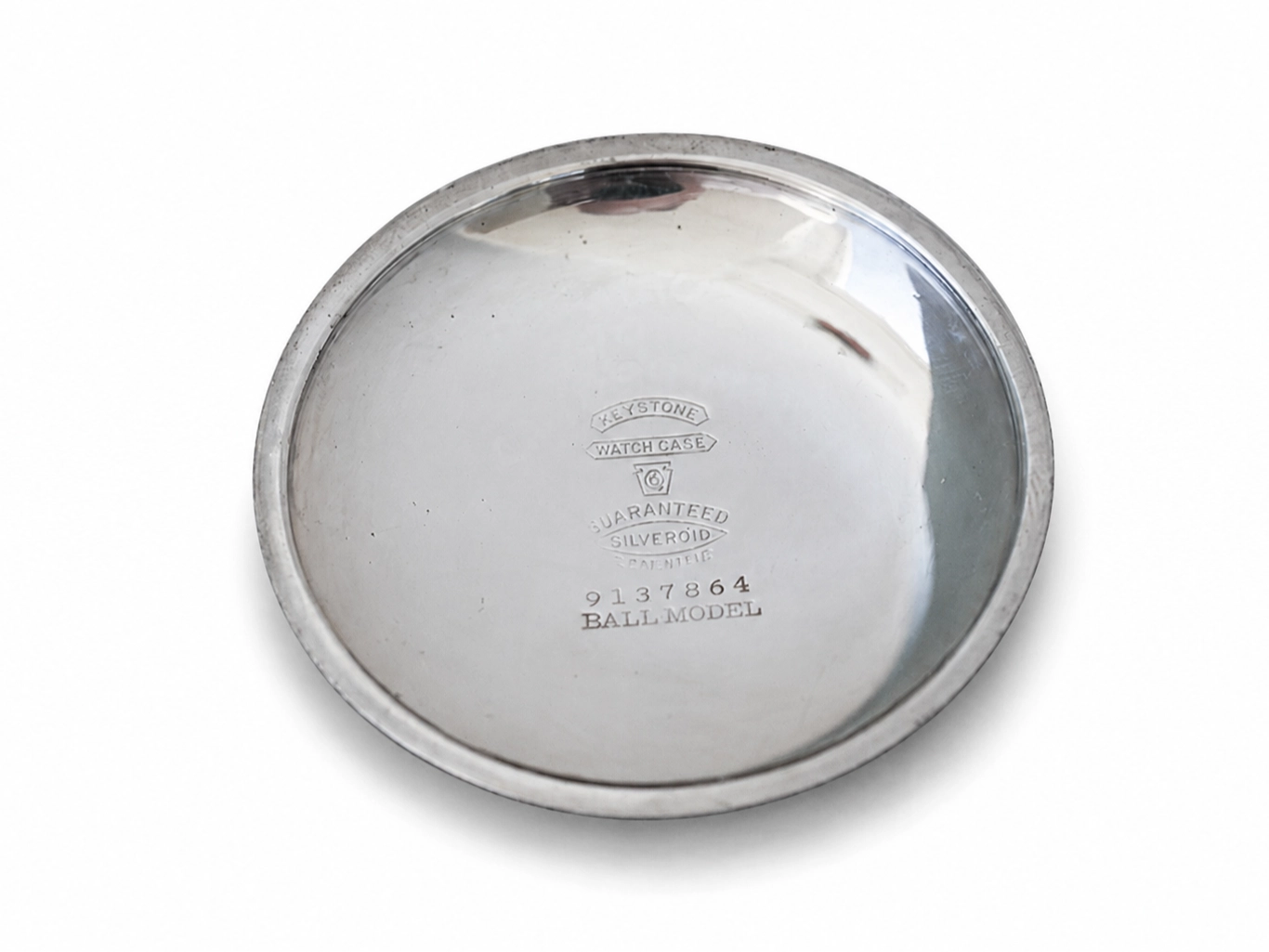 Polished case back engraved with Ball watch case guarantee marking and serial number 9137864.