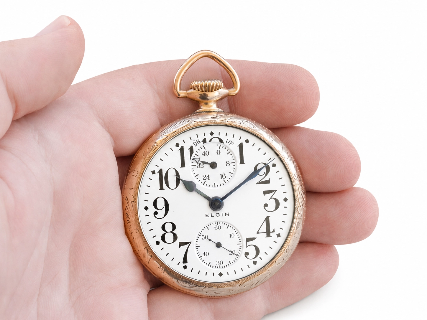 Gold-filled pocket watch with white dial, Arabic numerals, subsidiary seconds dial, and Elgin signature.