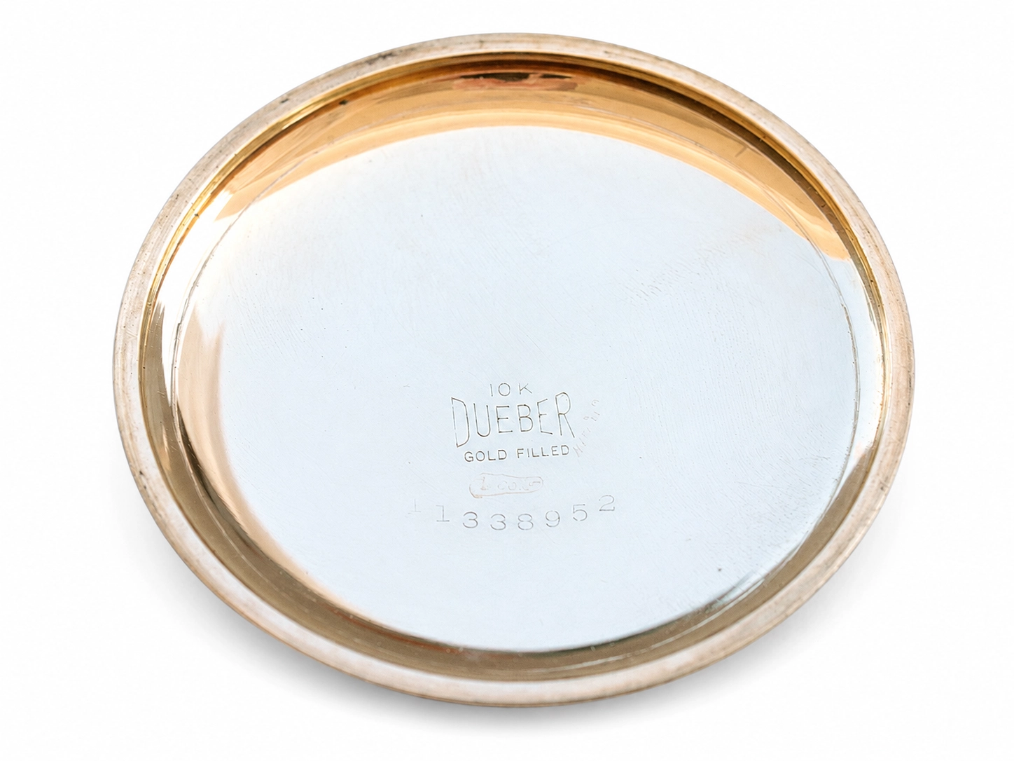 Engraved case back marked "10K DUEBER GOLD FILLED" with serial number visible.