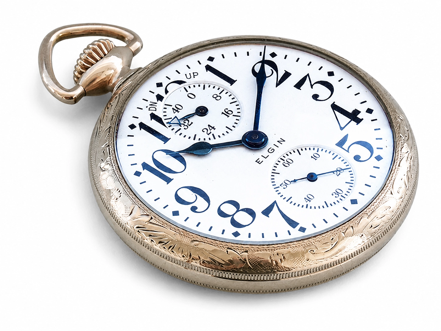 Pocket watch with white dial showing Arabic numerals, dual subdials, blued steel hands, and engraved silver case with ornate bail.