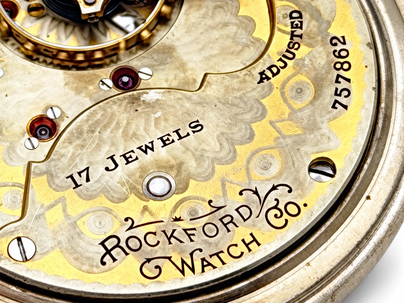 Rockford Grade 925 Hinged Salesman Display — open movement showing jeweled bearings with red ruby stones and spring-loaded levers,…