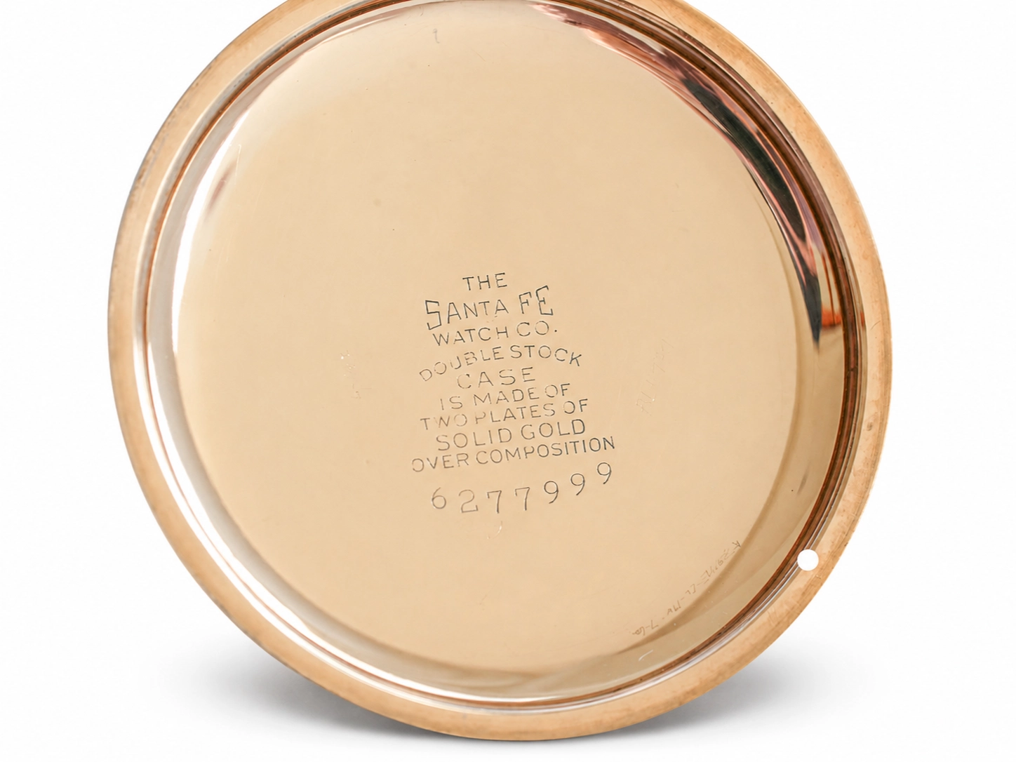 Gold case back engraved with Santa Fe Watch Co. double stock case and solid gold composition details.